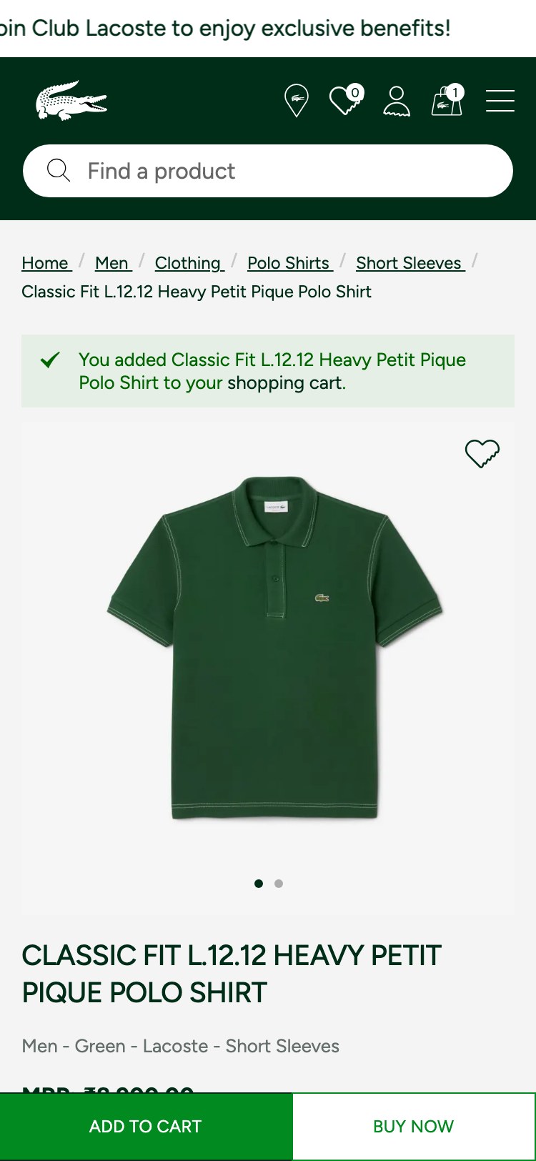 Lacoste — ATC confirmation state ('✓ You added Classic Fit L.12.12 Heavy Petit Pique Polo Shirt to your shopping cart.' plain green text banner inserted above breadcrumbs; no product thumbnail, no order subtotal, no cross-sell, no 'View Cart / Checkout' shortcuts)
